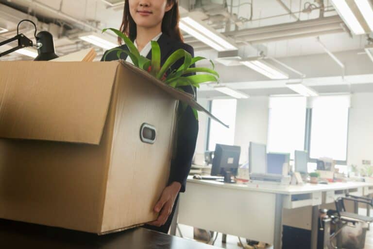 An office woman with a moving box