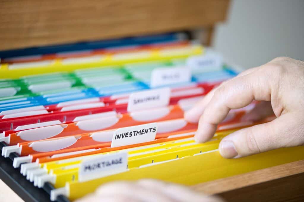 Financial documents filed in colour-coded folders