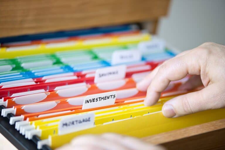 Financial documents filed in colour-coded folders